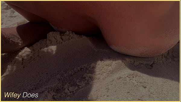 Partner concerts their breasts on the coastline